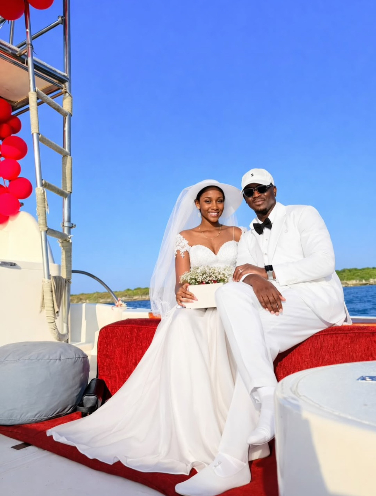 Couple celebrating on the catamaran deck