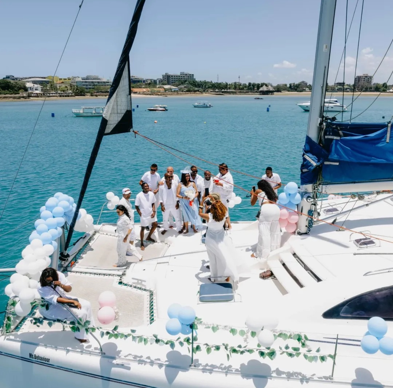 Guests enjoying a party on the yacht deck