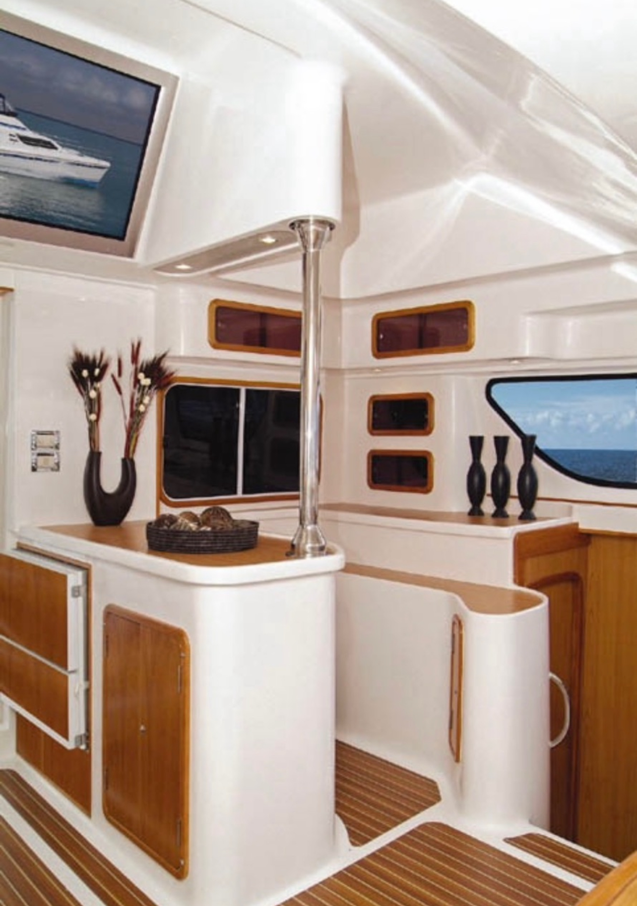 Catamaran galley and bar area with wood cabinetry
